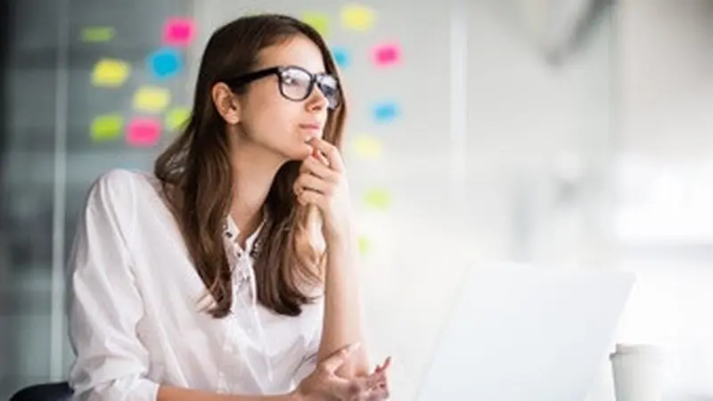 024218700 1623406742 successful businesswoman working laptop computer thinks new ideas her office dressed up white clothes 231208 4810
