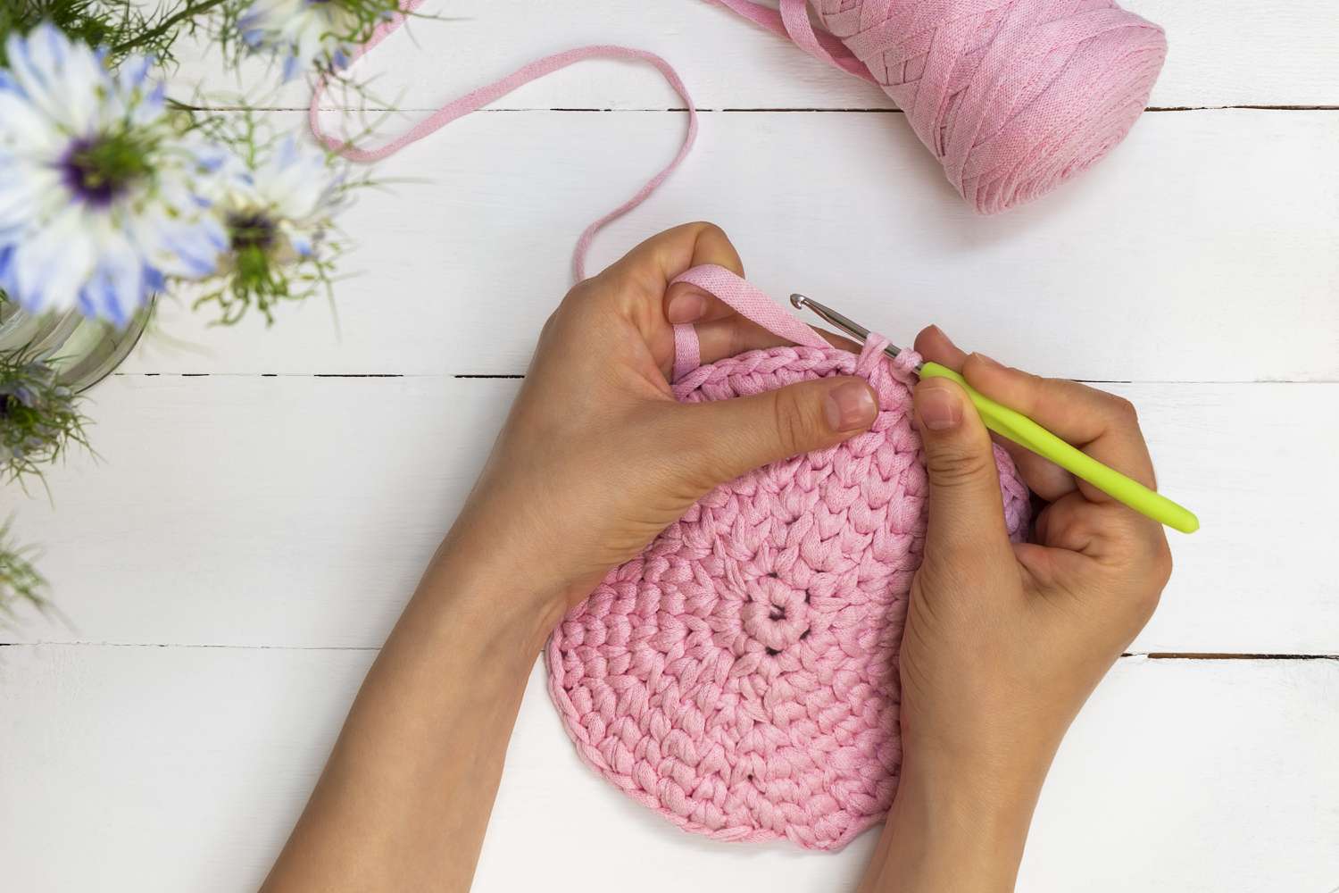 Bosen Liburanmu Gitu-gitu Aja? 8 Ide Aktivitas Seru ini Bisa Kamu Lakukan! 5 directly above view of woman hands holding crochet hook and crocheting with ribbon yarn 1249259826 c0645bc7105d4af886a1ac0fd3ea87ff
