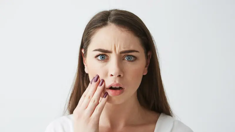 050191600 1611967050 close up photo displeased frightened girl touching face frowning 176420 9959