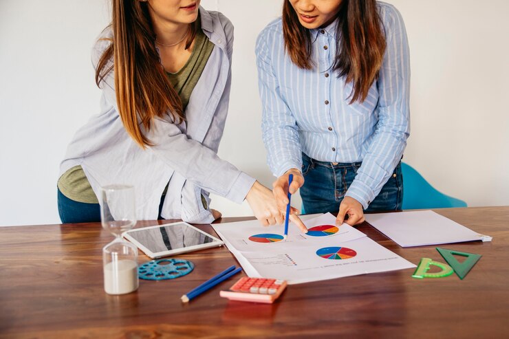 crop girls discussing analysis data 23 2147764686