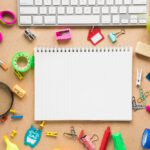 colorful school office supplies plain background