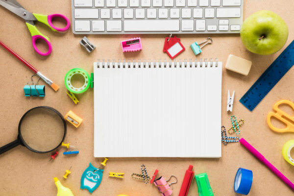 colorful school office supplies plain background