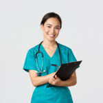 healthcare workers preventing virus quarantine campaign concept cheerful friendly asian female physician doctor with clipboard during daily checkup standing white background