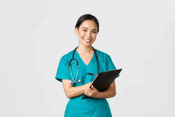 healthcare workers preventing virus quarantine campaign concept cheerful friendly asian female physician doctor with clipboard during daily checkup standing white background