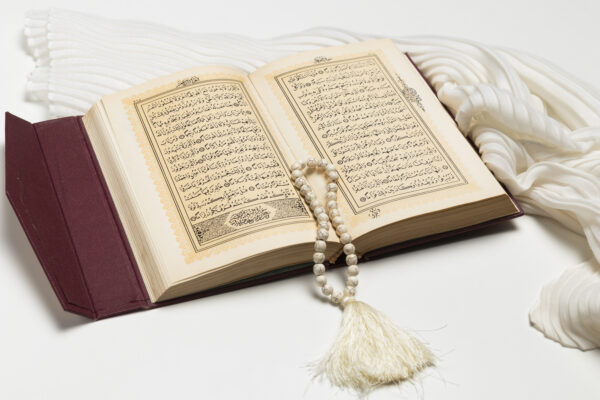 close up open holy book with bracelet