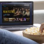 man watching streaming service his laptop