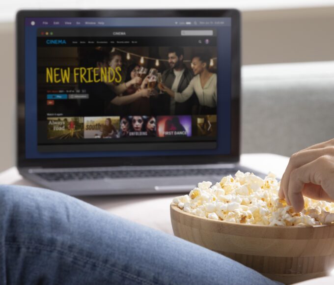 man watching streaming service his laptop