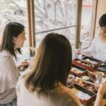 medium shot people sitting table together