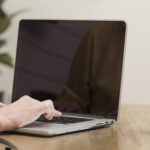 senior woman using laptop close up