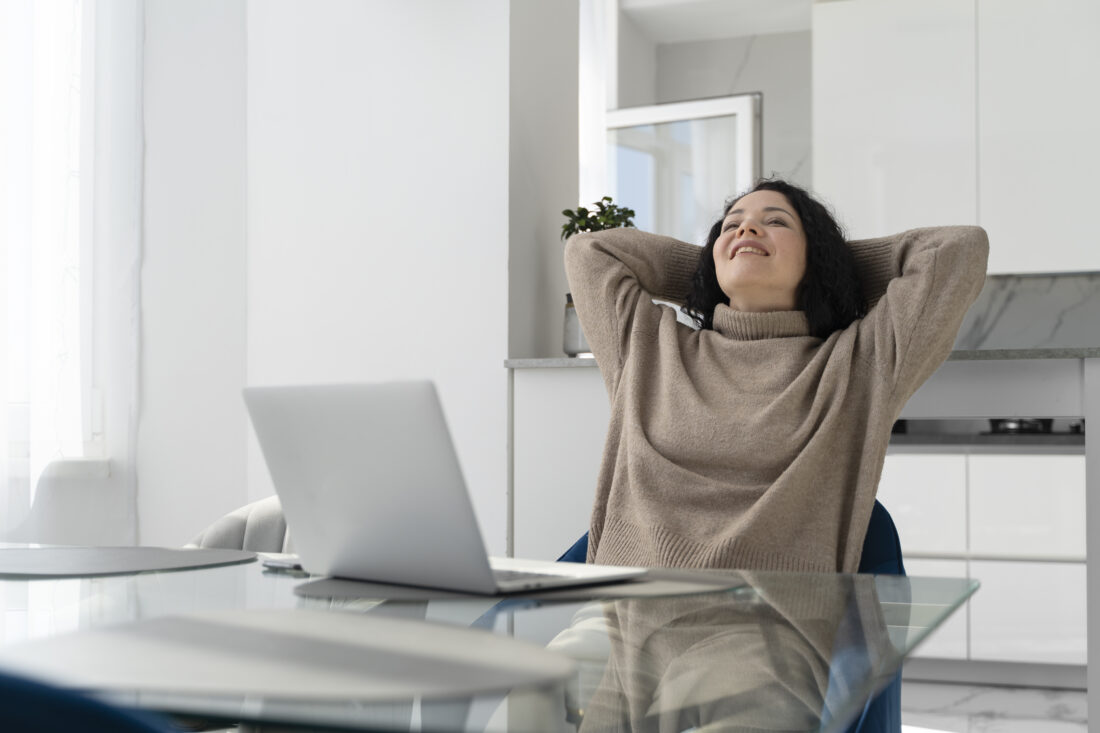 medium shot smiley woman with laptop
