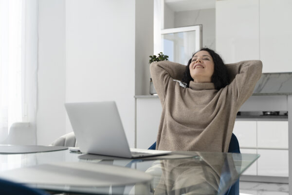 medium shot smiley woman with laptop