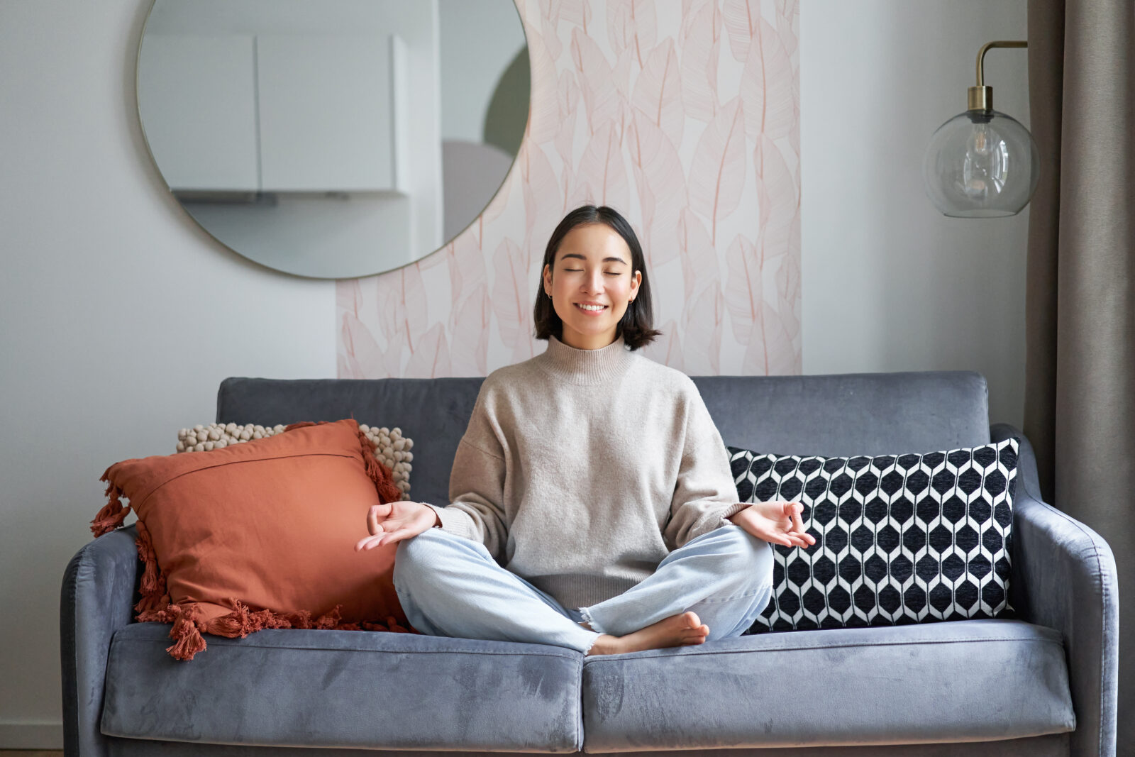 Aktivitas Seru Untuk Akhir Pekan 1 relaxation patience smiling young asian woman cozy room sitting sofa meditating doing