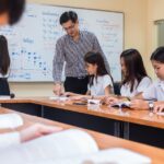 Menuju Pendidikan Merdeka: 3 Poin Kunci dalam Menggali Karakteristik Kurikulum Inovatif 3 20230802095032 fpdl.in asian teacher giving lesson group college students classroom 41418 989 large 1