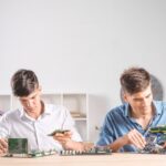 2 Kampus Robotic Terbaik di Indonesia Menurut TOP QS WUR 2024! 3 20230811084301 fpdl.in two male it technician checking computer mainboard service center 23 2147883873 large