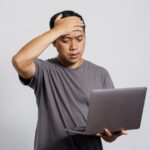 Tips Mengatasi Laptop Mati Mendadak dan Kembali Hidup dalam Sekejap! 3 20230816075048 fpdl.in sad unhappy asian man get bad news from laptop 368093 1414 large