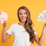 Tips Mendapatkan Uang Jajan  Untuk Anak Sekolah 5 portrait cheery young girl holding piggy bank 1 min scaled 1 780x470 1