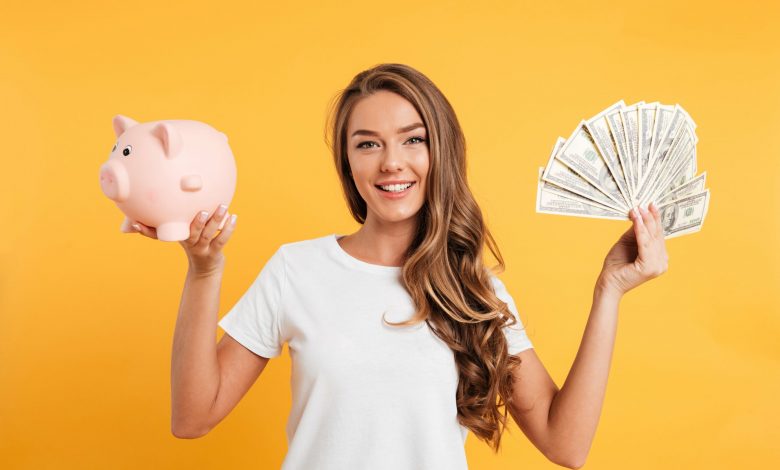 Tips Mendapatkan Uang Jajan  Untuk Anak Sekolah 1 portrait cheery young girl holding piggy bank 1 min scaled 1 780x470 1