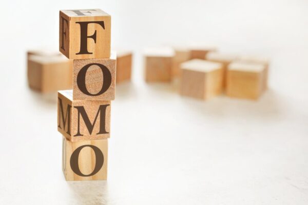 20230901054449 fpdl.in four wooden cubes arranged stack with letters fomo meaning fear missing out them space text image down right corner 692357 3341 large