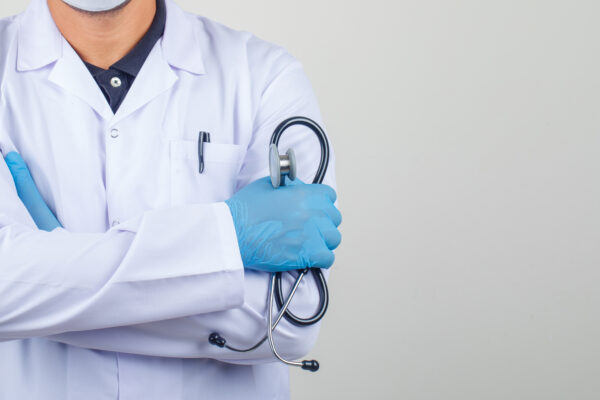 doctor crossing arms while holding stethoscope white coat 2
