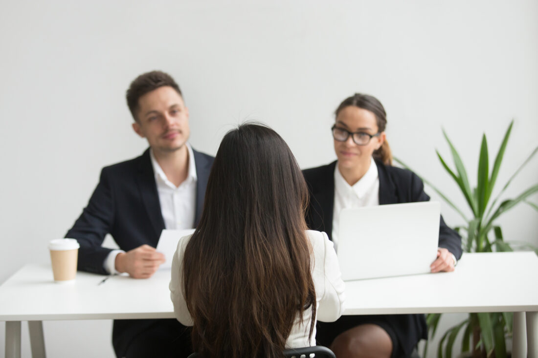 headhunters interviewing female job candidate