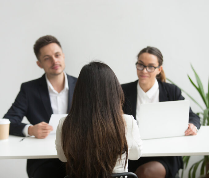 headhunters interviewing female job candidate