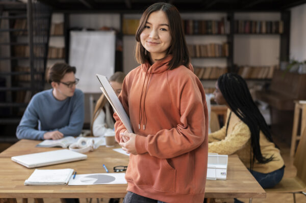 student posing during group study session with colleagues