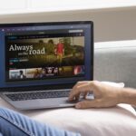 man watching streaming service his laptop