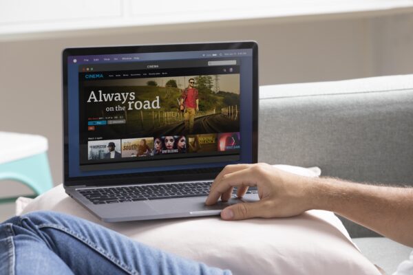 man watching streaming service his laptop
