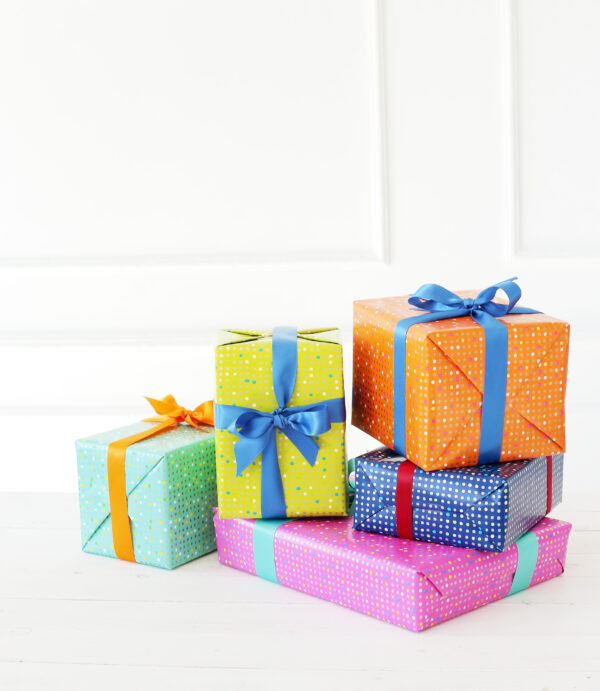 several colorful gifts with bow