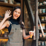 5 Ide Bisnis Bagi Anak Remaja, Bisa Nambah Uang Jajan dan Anti Ribet! 8 asia female ceramist with apron hand open entrance door home her workshop clay sculpture studio with positive smiling warm welcome ready open her newbie course learn how sculp ceramic art