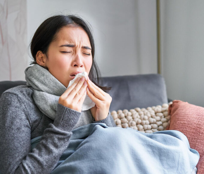 image sick korean woman home covered warm clothes scarf feeling sick catching cold