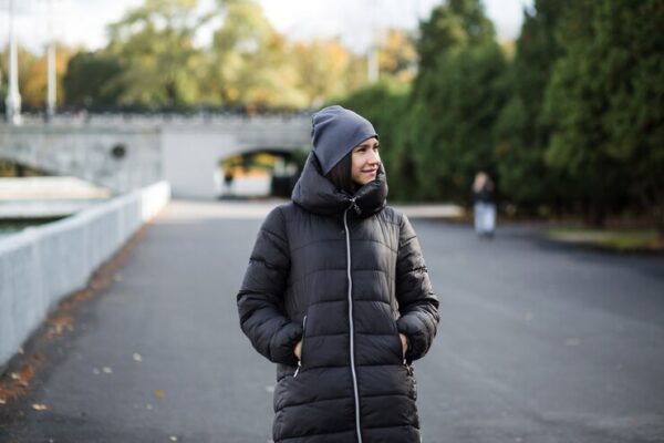 girl stands embankment near water warm clothes 354424 102