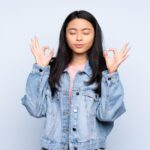 Cara Unik Mengatasi Stres Ala Orang Jepang! 5 teenager chinese woman isolated blue background zen pose 1368 117590