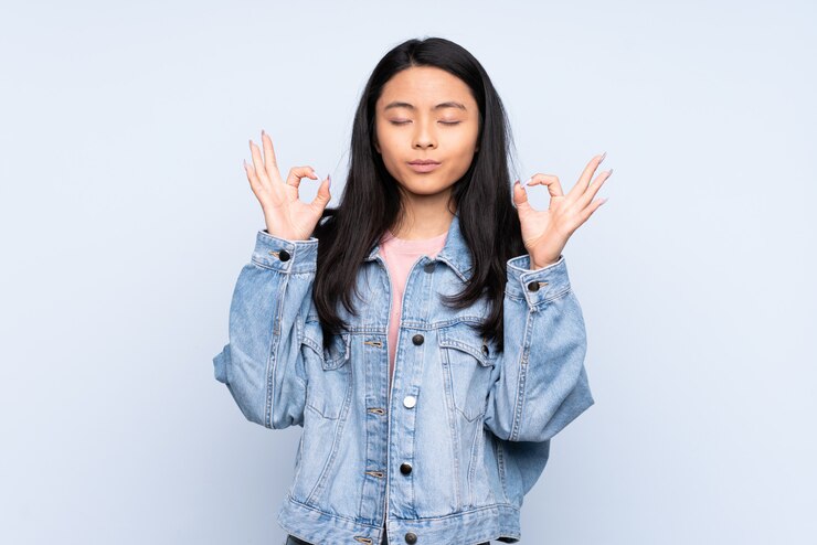 Cara Unik Mengatasi Stres Ala Orang Jepang! 1 teenager chinese woman isolated blue background zen pose 1368 117590