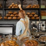 medium shot woman working bakery 23 2150273148