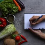 hand writing recipes book with food ingredients fresh vegetables kitchen 603656 1935