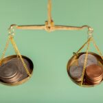 Emas vs Saham: Pilihan Investasi Cerdas untuk Gen Z, Mana yang Lebih Menguntungkan? 11 still life dollar coins scale 23 2150794355