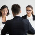 serious unconvinced diverse hr managers interviewing male job applicant 1163 4675