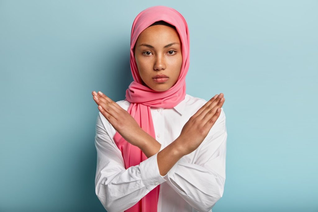 beautiful serious arabian woman wears pink hijab makes cross with hands chest 273609 25357