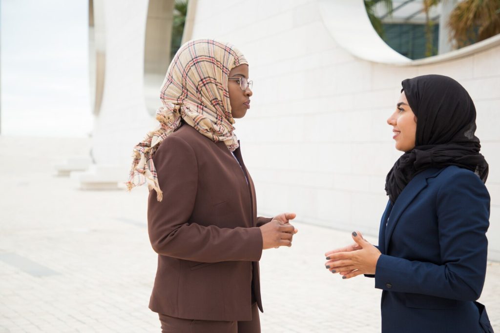 confident muslim businesswomen discussing project 74855 1574